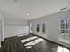 Versatile bonus room with hardwood floors, and multiple windows providing natural light, perfect for a den at 414 Fox Fire Run, Gastonia, NC 28052