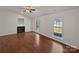 Bright living room with a fireplace, hardwood floors, and natural light at 414 Fox Fire Run, Gastonia, NC 28052