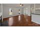 Inviting living room with hardwood floors, a ceiling fan, and plenty of natural light from large windows at 414 Fox Fire Run, Gastonia, NC 28052