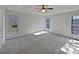 Bright primary bedroom features a tray ceiling, neutral walls, carpet, and lots of light at 414 Fox Fire Run, Gastonia, NC 28052