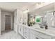 Elegant bathroom with double sinks, marble countertops, and a separate tub and shower at 419 Balboa St, Matthews, NC 28104