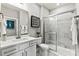 Modern bathroom featuring a sleek glass-enclosed shower and elegant marble finishes at 419 Balboa St, Matthews, NC 28104