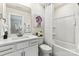 Bright bathroom features a modern vanity, stylish mirror, and shower-tub combination at 419 Balboa St, Matthews, NC 28104