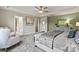 Bright bedroom featuring a tray ceiling, and access to an ensuite bathroom and walk-in closet at 419 Balboa St, Matthews, NC 28104
