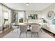 Elegant dining room with light hardwood floors and plenty of natural light at 419 Balboa St, Matthews, NC 28104