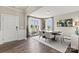 Bright dining room with hardwood floors, a modern light fixture, and large windows at 419 Balboa St, Matthews, NC 28104