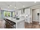 Modern kitchen with a large island, white cabinets, and stainless steel appliances at 419 Balboa St, Matthews, NC 28104