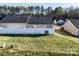 Fenced backyard with grass and trees in a residential neighborhood at 450 Guiness Pl, Rock Hill, SC 29730