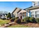 Well-maintained home featuring mature landscaping and a welcoming front porch at 450 Guiness Pl, Rock Hill, SC 29730