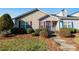 Attractive home boasts a mix of siding, manicured shrubs, and colorful shutters at 450 Guiness Pl, Rock Hill, SC 29730