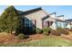 Charming home features manicured landscaping and a mix of shingle and vinyl siding at 450 Guiness Pl, Rock Hill, SC 29730
