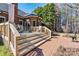 A multi-tiered deck and brick patio add beauty to the home's exterior at 4522 Long Cove Dr, Denver, NC 28037