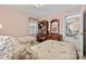 Comfortable bedroom with twin beds, a wooden desk, and access to a living area, blending relaxation and functionality at 4522 Long Cove Dr, Denver, NC 28037