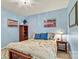 Comfortable bedroom features floral bedding, wooden furniture, and soft lighting, creating a warm and inviting space at 4522 Long Cove Dr, Denver, NC 28037