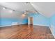 This bonus room features laminate flooring, recessed lighting and an open doorway at 4522 Long Cove Dr, Denver, NC 28037