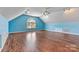 The bright bonus room is large and features laminate flooring and recessed lighting at 4522 Long Cove Dr, Denver, NC 28037