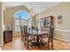 Dining room with hardwood floors, chandelier, large window, and classic wood china cabinet at 4522 Long Cove Dr, Denver, NC 28037