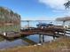 This lakefront property includes a private dock with several boat slips, perfect for boating and enjoying the serene water views at 4522 Long Cove Dr, Denver, NC 28037