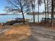 The property features a private dock with multiple boat slips, providing direct access to the serene waters of the lake at 4522 Long Cove Dr, Denver, NC 28037