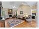 Cozy living room with brick fireplace, hardwood floors, and ample seating at 4522 Long Cove Dr, Denver, NC 28037
