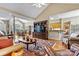 Open-concept living area with hardwood floors, fireplace, and views into kitchen at 4522 Long Cove Dr, Denver, NC 28037