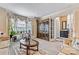 Comfortable living room featuring a large window, a built-in cabinet and a glass coffee table at 4522 Long Cove Dr, Denver, NC 28037