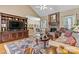 Bright living space with a brick fireplace, large TV, and hardwood flooring at 4522 Long Cove Dr, Denver, NC 28037