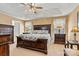 This spacious main bedroom features neutral walls, tray ceiling and an elegant bedroom set at 4522 Long Cove Dr, Denver, NC 28037