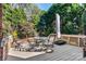 Outdoor deck featuring a table and chairs, ideal for relaxing and enjoying the surrounding natural beauty at 4522 Long Cove Dr, Denver, NC 28037