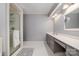 Bright bathroom showcasing a glass shower and a vanity with ample countertop space at 4605 Curraghmore Rd, Charlotte, NC 28210