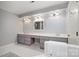 Bathroom featuring a double vanity with lots of storage and large mirrors at 4605 Curraghmore Rd, Charlotte, NC 28210