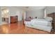 Large bedroom with hardwood floors, ceiling fan, and an en-suite bathroom at 4605 Curraghmore Rd, Charlotte, NC 28210