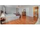Comfortable bedroom with hardwood floors, ceiling fan and plenty of natural light at 4605 Curraghmore Rd, Charlotte, NC 28210