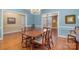 Elegant dining room with a chandelier, hardwood floors, and ample space for entertaining at 4605 Curraghmore Rd, Charlotte, NC 28210