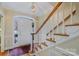 Bright foyer with hardwood floors, a staircase, and a decorative front door with stained glass at 4605 Curraghmore Rd, Charlotte, NC 28210
