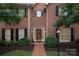 Charming two-story brick home featuring a classic design, well-maintained landscaping, and a welcoming front entrance at 4605 Curraghmore Rd, Charlotte, NC 28210