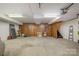 Spacious garage with concrete floor and ample space for vehicles and storage at 4605 Curraghmore Rd, Charlotte, NC 28210