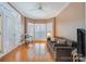 Comfortable Gathering room with shuttered windows, couch and natural light at 4605 Curraghmore Rd, Charlotte, NC 28210