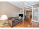 Cozy living room with a couch and open access to other rooms at 4605 Curraghmore Rd, Charlotte, NC 28210