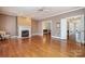 Comfortable living room features a fireplace and easy access to other rooms at 4605 Curraghmore Rd, Charlotte, NC 28210