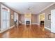 Spacious living room with a fireplace and elegant white trim at 4605 Curraghmore Rd, Charlotte, NC 28210