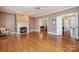 Comfortable living room features a fireplace and easy access to other rooms at 4605 Curraghmore Rd, Charlotte, NC 28210