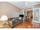 Cozy living room with a couch and open access to other rooms at 4605 Curraghmore Rd, Charlotte, NC 28210