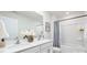 Well-lit bathroom features a double sink vanity and a shower-tub combo with modern fixtures at 5050 Beargrass Dr, Dallas, NC 28034