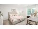 Inviting bedroom boasts a comfortable bed, soft textures, and a charming workspace by the window at 5050 Beargrass Dr, Dallas, NC 28034