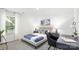 Bright bedroom features a cozy bed, stylish decor, and a functional workspace near a window at 5050 Beargrass Dr, Dallas, NC 28034