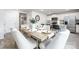 Elegant dining area with seating for six and views into kitchen at 5050 Beargrass Dr, Dallas, NC 28034