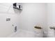 Functional laundry room with storage shelves and ample space for laundry tasks at 5050 Beargrass Dr, Dallas, NC 28034