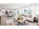 Inviting living room featuring hardwood floors, a large sofa, and natural lighting at 5050 Beargrass Dr, Dallas, NC 28034