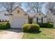 Charming single-story home with a front yard and attached garage at 5120 Silabert Ave, Charlotte, NC 28205